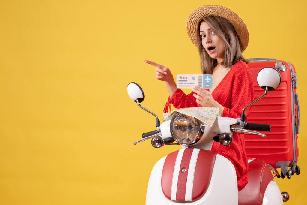front-view-young-lady-red-dress-holding-ticket-pointing-left-moped